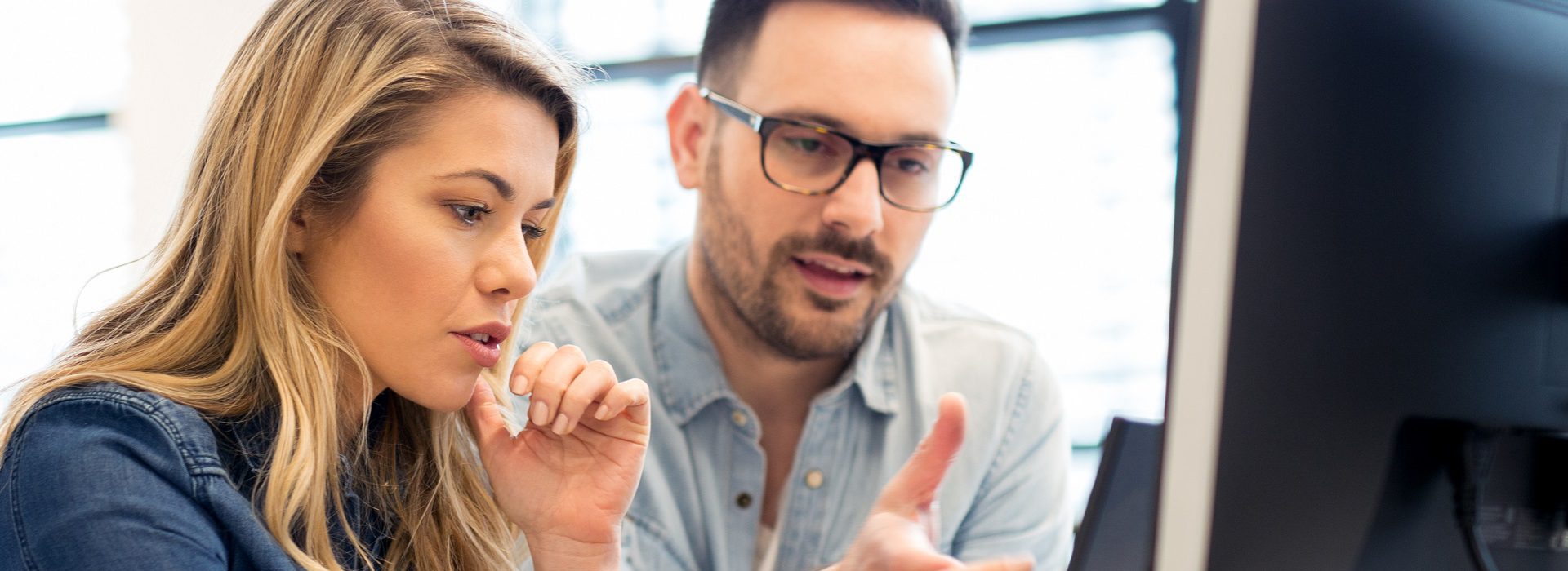 Group of business people and software developers working as a team in office